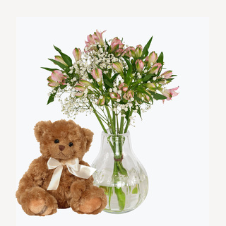 Blomsterhilsen med alstromeria og bamse